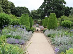 Herbaceous borders with central path leading to fountain