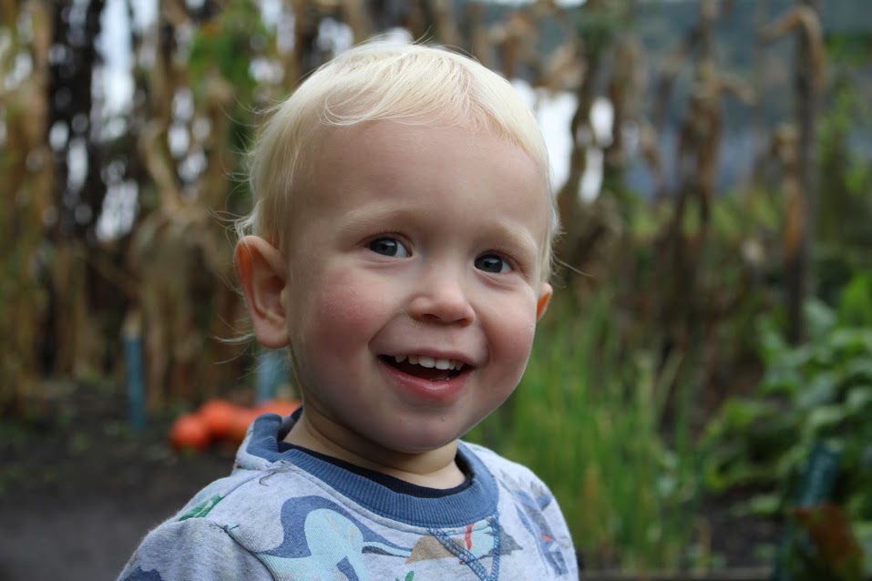 Max looking up in amazement with shy smile