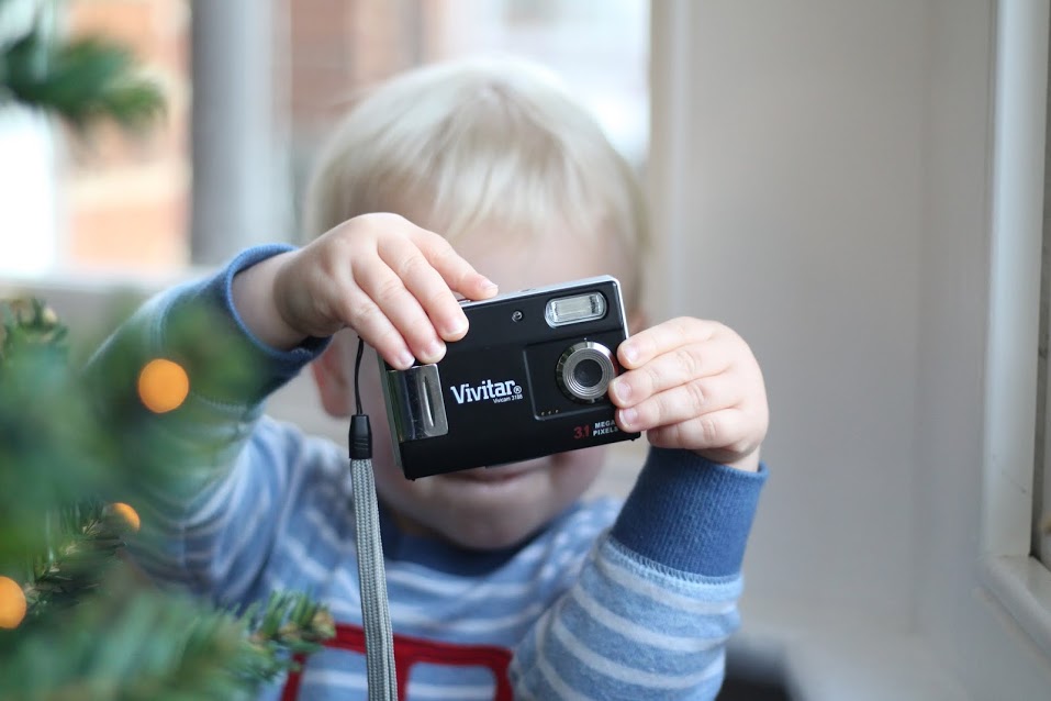 Max holding up camera to take a shot