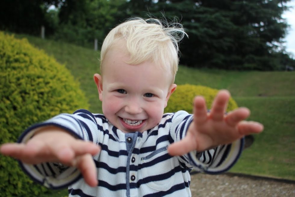 Max walking towards the camera with arms outstretched