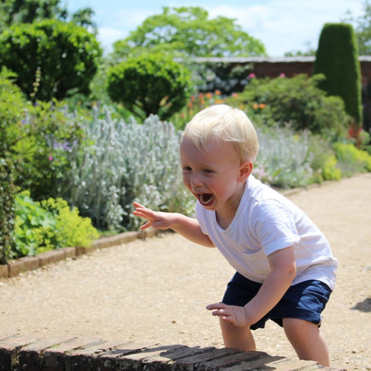 Max throwing stones into pond
