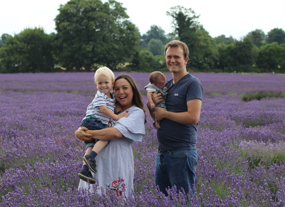 Katy holding Max and John holding Ben, stood in lavender fields