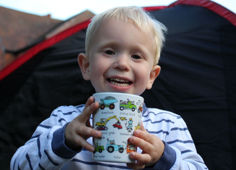 Max holding cup of hot chocolate