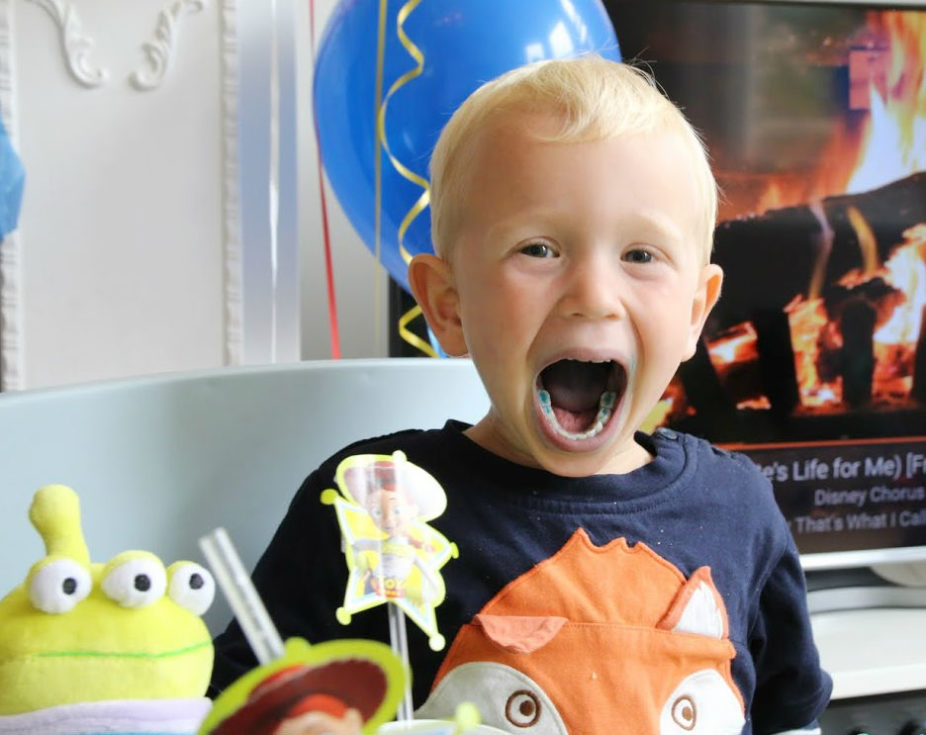 Max with mouth wide open showing blue teeth and tongue