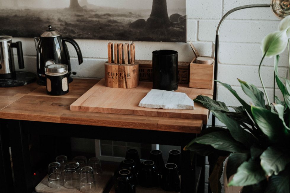 Industrial look kitchen worktop, with wooden chopping board