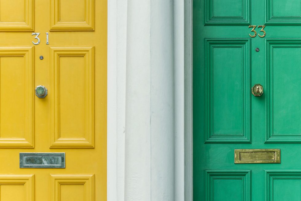 Yellow and green doors alongside each other