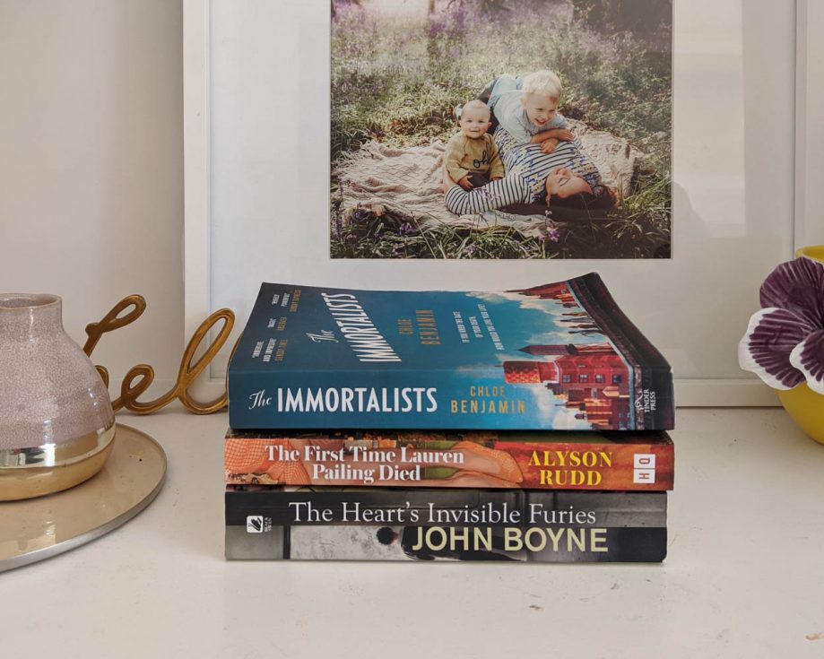 A pile of 3 books. The Immortalists, The First Time Lauren Pailing Died, and The Heart's Invisible Furies